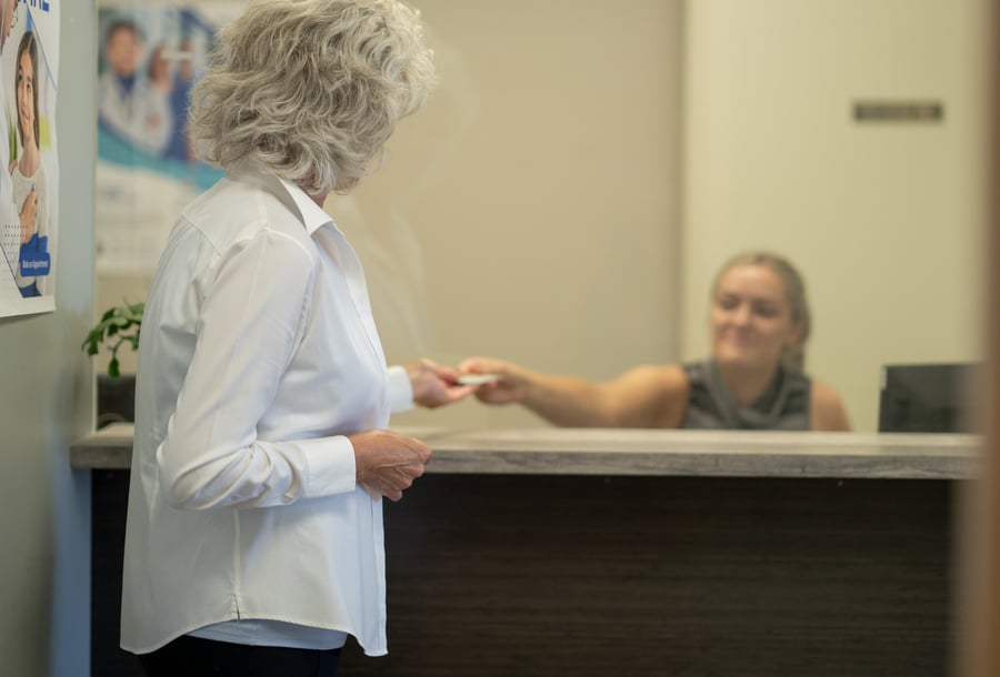 receptionist using Automated Insurance Verification