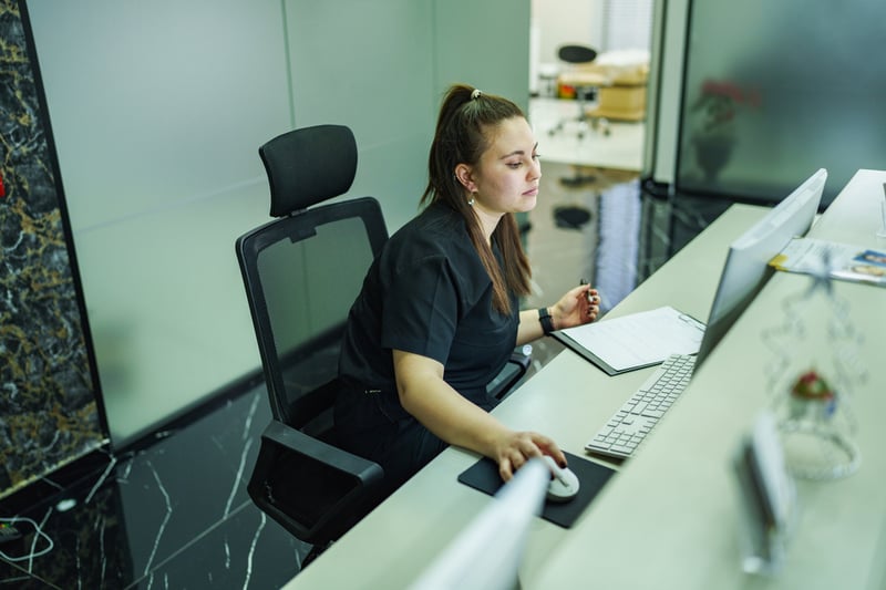 doctor's office receptionist running automatic eligibility check